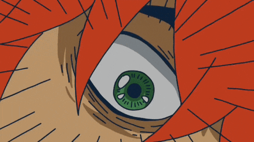 a close up of a person 's eye with green pupil