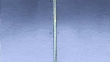 a metal pole with screws on it is against a blue sky