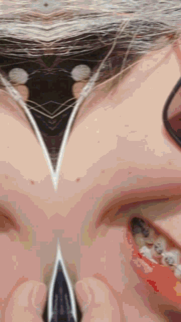 a close up of a person 's face with braces on
