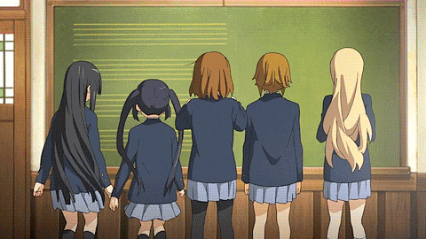 four anime girls are standing in front of a blackboard with music notes on it