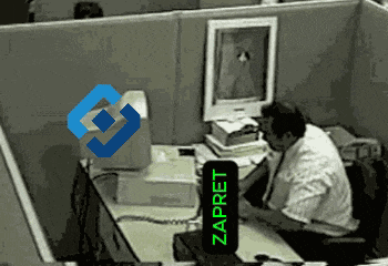 a man sits at a desk in front of a computer with a sign that says zapret