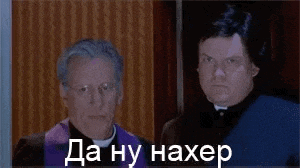 two men are standing next to each other in a room and one of them is wearing a purple robe .