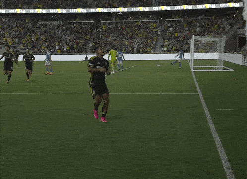 a soccer game is being played in a stadium that says crew on the stands