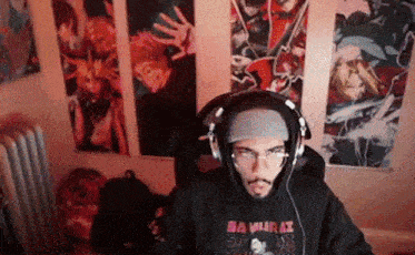 a man wearing headphones and a samurai sweatshirt