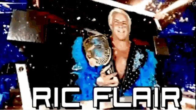 a picture of ric flair holding a wrestling trophy