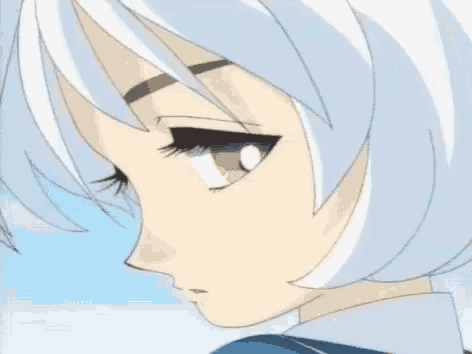 a close up of a girl 's face with short white hair and brown eyes .