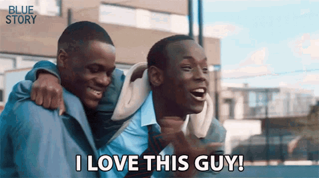 two young men are hugging each other and one of them is saying " i love this guy "