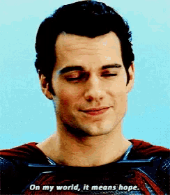 a close up of a man 's face with a caption that says on my world it means hope