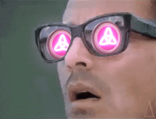 a man wearing a pair of glasses with a pink triangle in the center of his eyes
