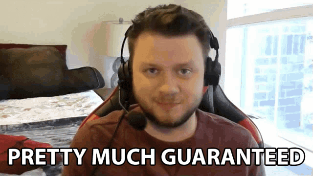a man wearing headphones and a microphone says " pretty much guaranteed "