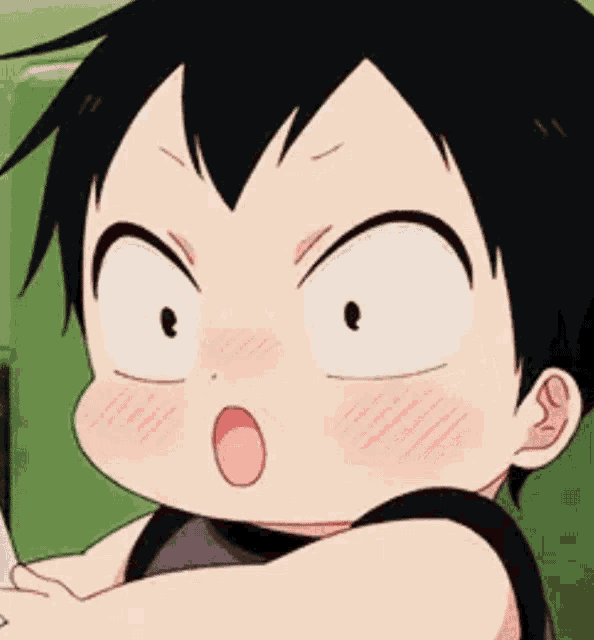 a close up of a child making a funny face with his mouth open .