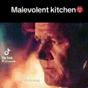 a close up of a man 's face with the words `` malevolent kitchen '' written on the bottom .