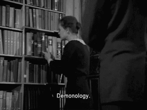 a black and white photo of a woman in a library with pornography written on the bottom right