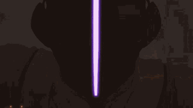 a close up of a person 's face with a light coming out of it