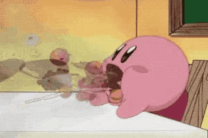 a pink cartoon character is sitting at a table
