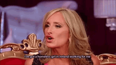 a woman is sitting in a chair with the words i 've got a homeless girl in ireland working for me above her