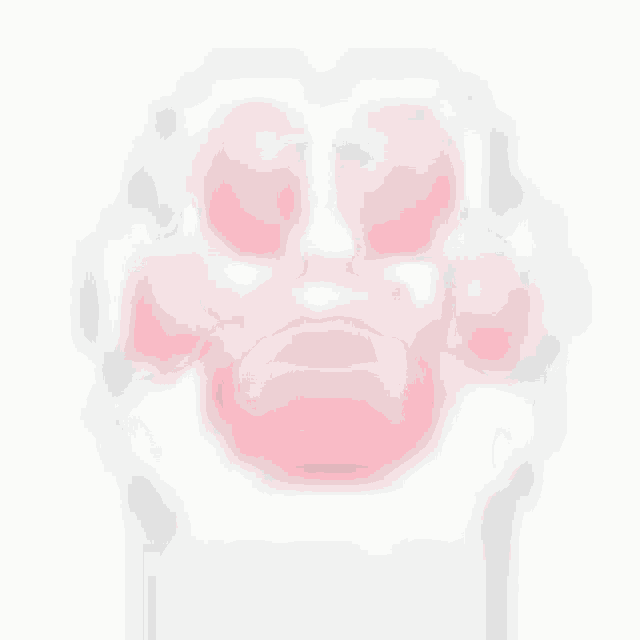 a pink purse with a paw print on it is sitting on a white table .