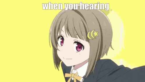 a girl in a school uniform is making a funny face with her hands up .