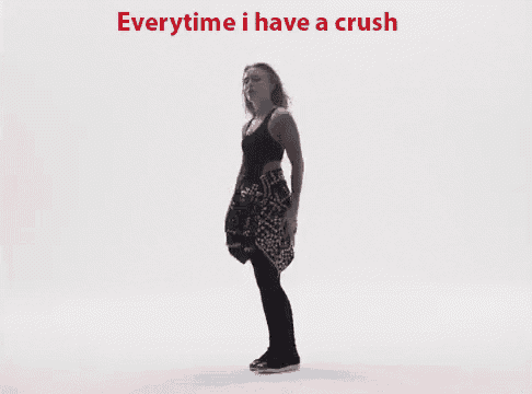 a girl holding a red heart with the words everytime i have a crush written above her