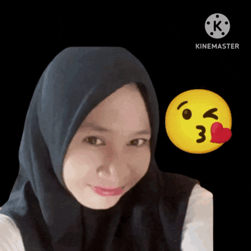 a woman wearing a black hijab is being kissed by a yellow smiley face