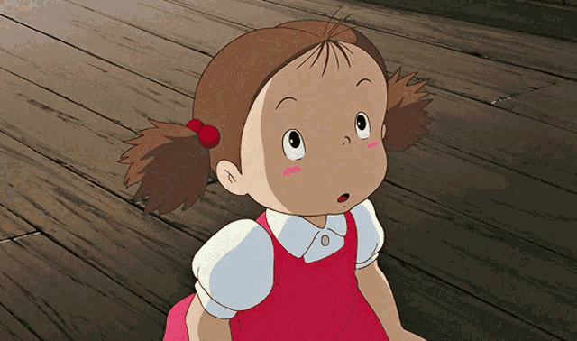 a cartoon girl in a red dress and white shirt is sitting on a wooden floor