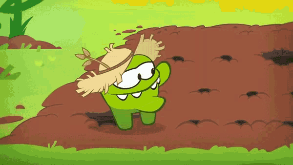 a cartoon character wearing a straw hat is standing in a field of dirt