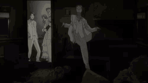a man in a suit is dancing in a dark room with a sign that says ' a ' on it