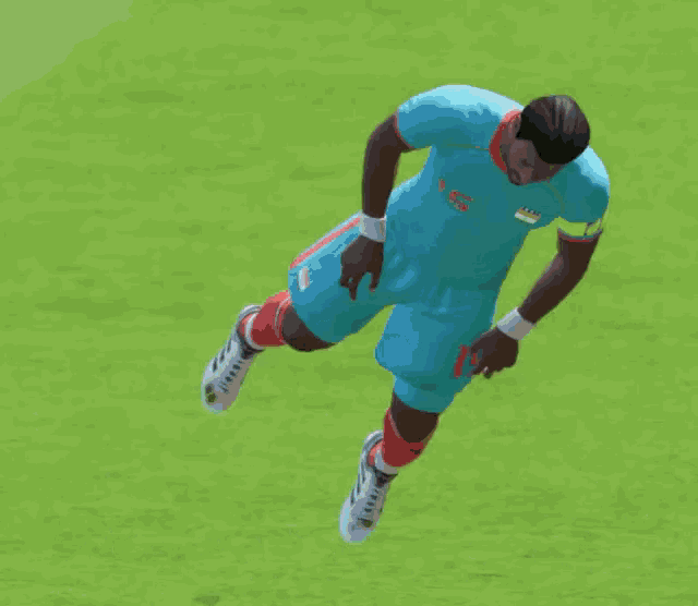 a soccer player is laying on the grass with the word monday behind him