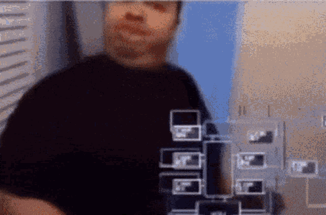 a blurry picture of a man wearing a black t-shirt that says ' ufc '