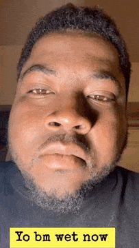 a close up of a man 's face with a beard and the words `` yo bm wet now '' on the bottom .