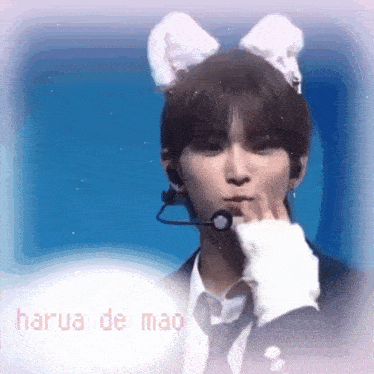 a man wearing bunny ears and a microphone on his head