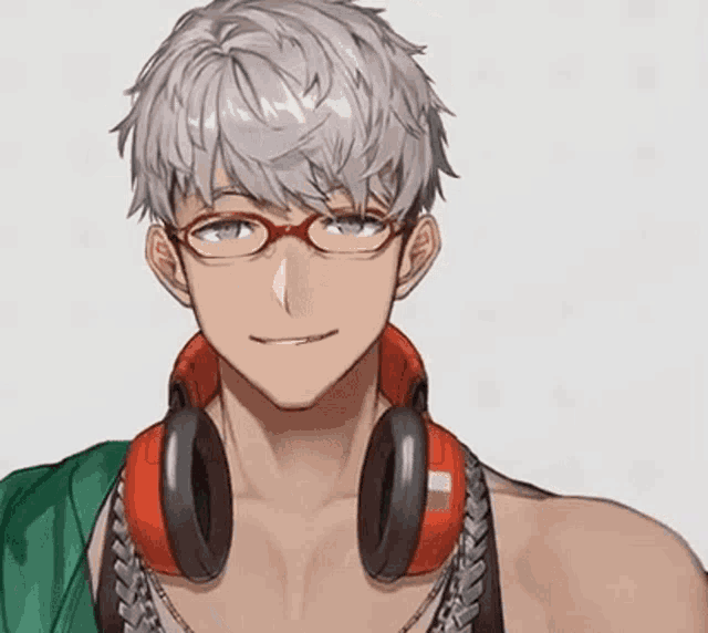 a young man with glasses and headphones around his neck is smiling .