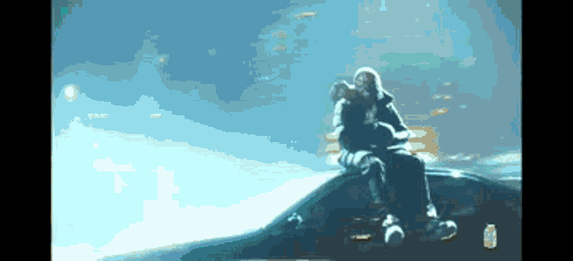 a man sitting on the roof of a car