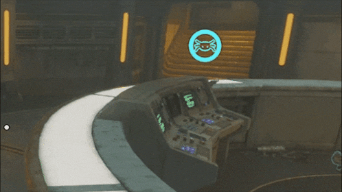 a man is standing in front of a control panel that says e on it