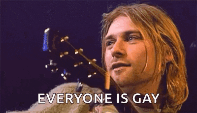 a close up of a man 's face with the words `` everyone is gay '' written on it .
