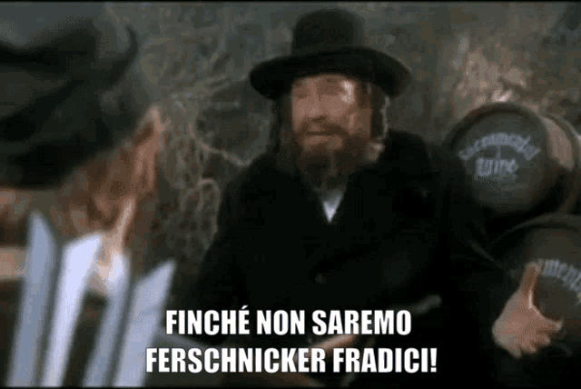 a man in a black hat says finche non saremo ferschnicker fradic