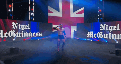 a wrestler named nigel mcguinn is on stage