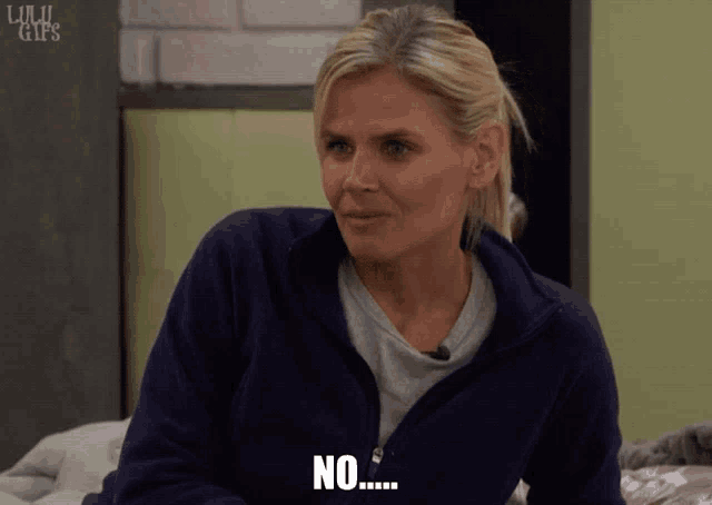 a woman in a blue jacket says no on the screen