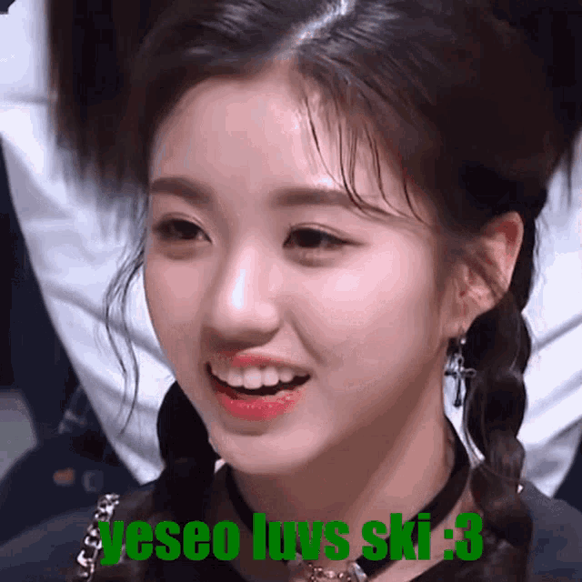a close up of a woman 's face with the words " jeseo luvs ski-s " written below her