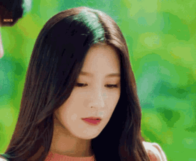 a close up of a woman 's face with her eyes closed