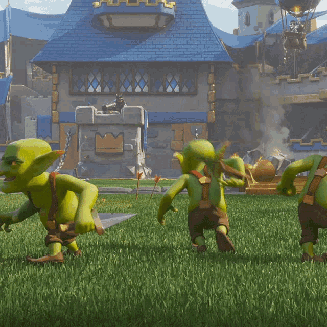 a group of goblins are playing a video game in front of a blue building