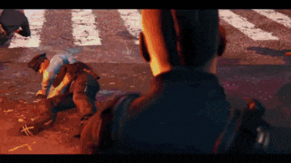 a police officer is kneeling down next to another police officer on the street