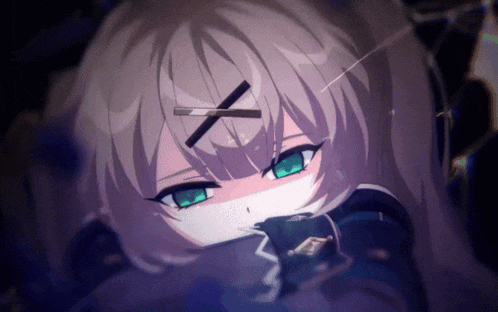 a close up of a girl with green eyes and a black x on her head