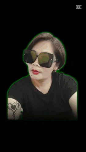 a woman wearing sunglasses with the words happy tasking written above her