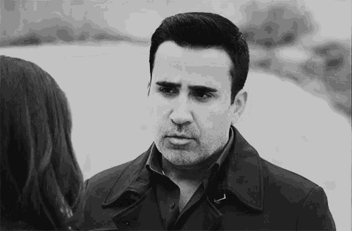 a black and white photo of a man and woman