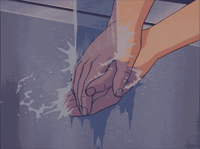 a person washing their hands in a sink with water coming out of it