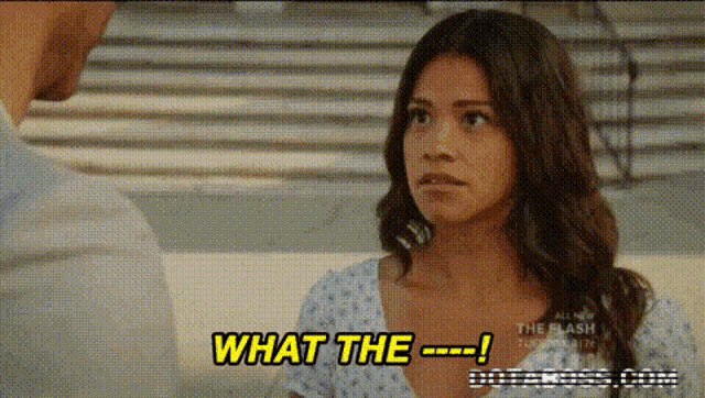 a woman in a hospital gown is talking to a man in a hospital room .