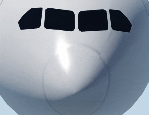 a close up of an airplane 's nose with black squares