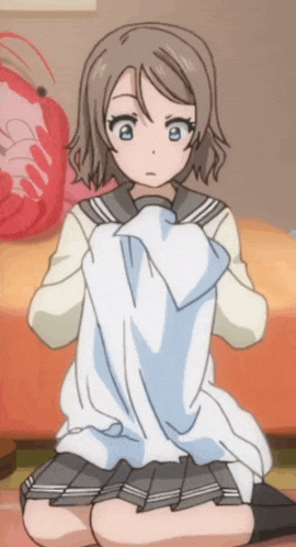 a girl in a school uniform is kneeling down holding a white cloth