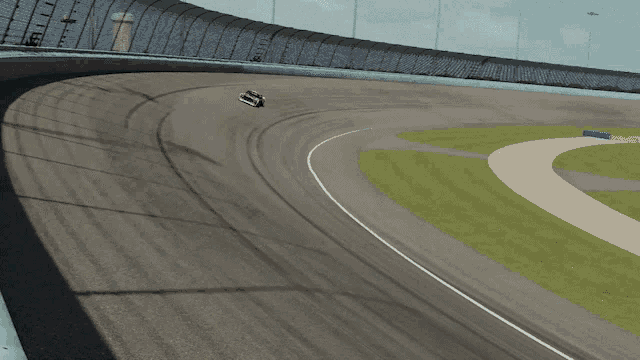 a close up of a race track with a shadow on the ground